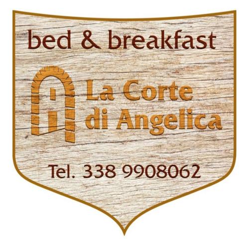 夏卡的住宿－La corte di Angelica，一张木制标志,读了la cole de cl americoria住宿加早餐旅馆