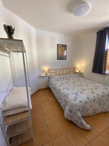a bedroom with a bed and a ladder in it at La Casa di Diana in Montecchio