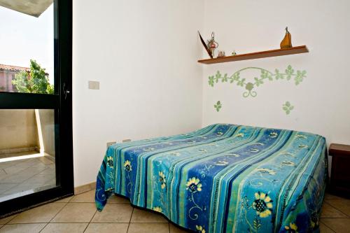 Ένα ή περισσότερα κρεβάτια σε δωμάτιο στο Casa vacanza S'ulivàriu - Posada