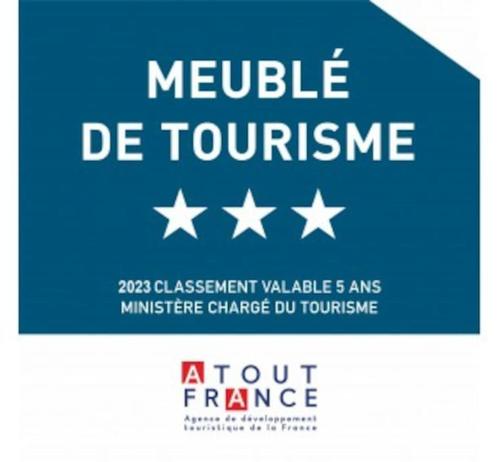 a sign that reads module de tourismence with white stars at Pégase meublé 3*** in Fourchambault