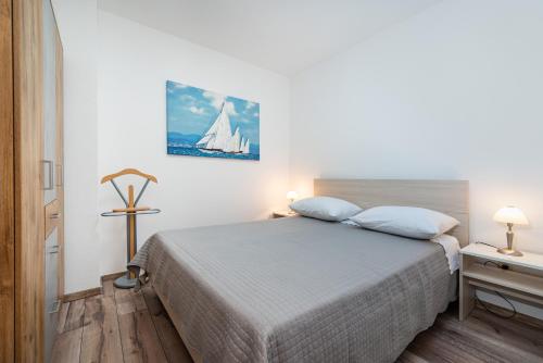 Кровать или кровати в номере Poseidon Apartmani