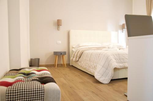 Postel nebo postele na pokoji v ubytování Minerva Rooms