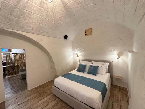 Un pat sau paturi într-o cameră la Dara casa vacanza & Relax Suite