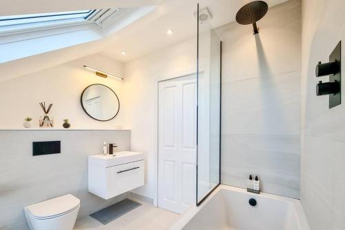 a bathroom with a toilet and a sink and a shower at ScandicStay-Apartment Harrogate in Harrogate