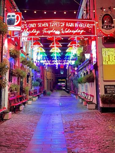 an alley with christmas lights on a street at Cheerful and Cosy Double Room in Belfast