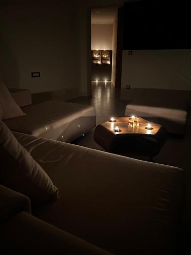 a living room with a couch and a table with candles at Ivana&Luka-Put luke 1, Brela in Brela