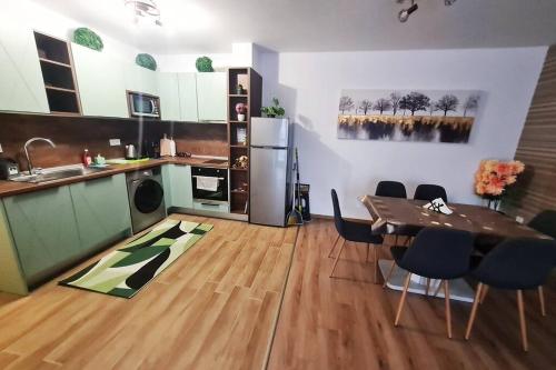 a kitchen with a table and a kitchen with a dining room at ERAS - Топ център Варна in Varna City