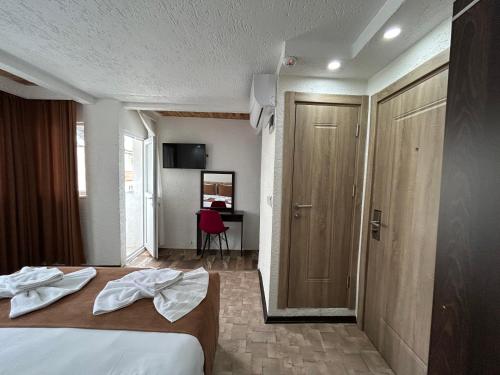 Cama o camas de una habitación en HOTEL GLOBAL 2022