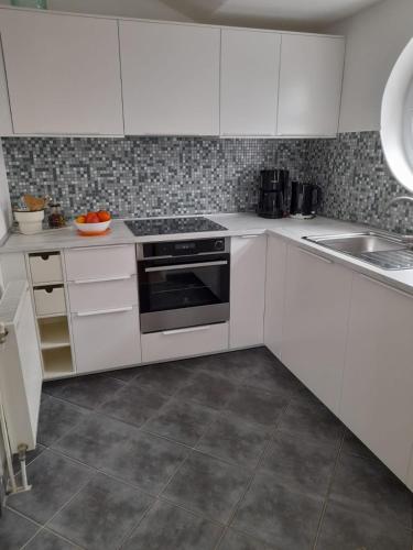 Η κουζίνα ή μικρή κουζίνα στο Apartments A&T