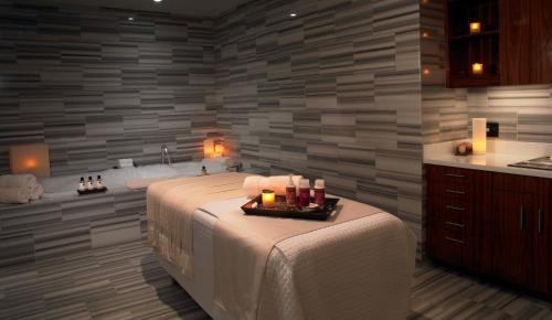 a bedroom with a bed with a tray of candles on it at Trump International Hotel Las Vegas in Las Vegas