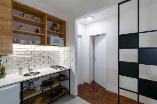 a kitchen with a sink and a counter at Franca Estadías Temporarias in Rosario