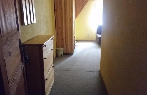 a hallway with a dresser and a door to a room at Salas-Partizanske in Partizánske