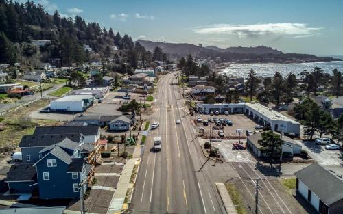 an aerial view of a small town next to the water at Beauty On The Beach in Depoe Bay