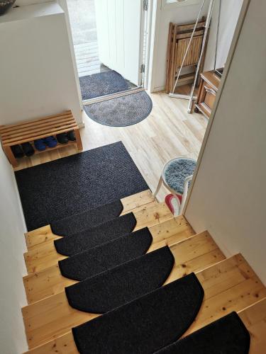 a view of a staircase in a room at Tofta Konstgalleri-Familjelägenhet in Varberg
