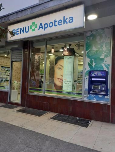 a store front of a store with a sign on the window at Centre two bedrooms apartment in Podgorica