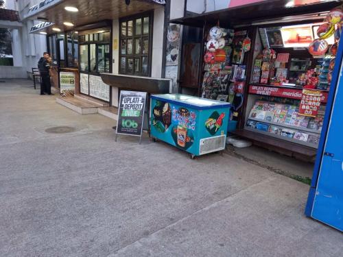 a store with a sign in front of it at Centre two bedrooms apartment in Podgorica