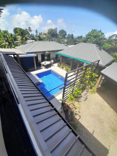 an aerial view of a house with a swimming pool at Bidesi Apartments in Suva
