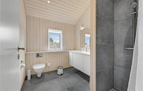 a bathroom with a shower and a toilet and a sink at 3 Bedroom Beach Front Home In Kalundborg in Kalundborg