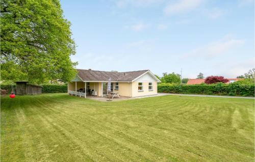 a house with a large lawn in front of it at 3 Bedroom Pet Friendly Home In Hejls in Hejls