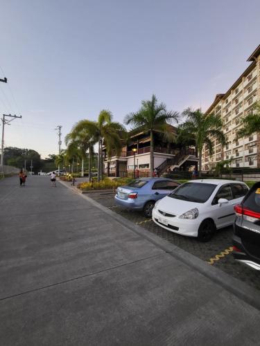 a group of cars parked in a parking lot at Steff's Condo 2622 at One Oasis in Cagayan de Oro