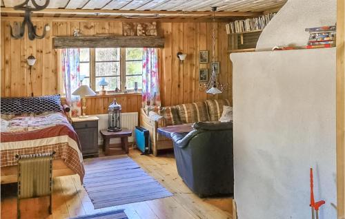 a living room with a bed and a couch at Gorgeous Home In Enviken With Kitchen in Enviken