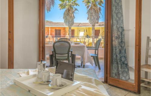 a dining room with a table and a mirror at Bilo 4 Premium in Palau