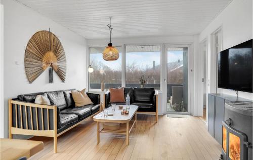 a living room with a couch and a table at Lovely Home In Otterup With Wifi in Otterup