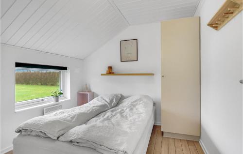 a bedroom with a bed and a window at Lovely Home In Otterup With Wifi in Otterup