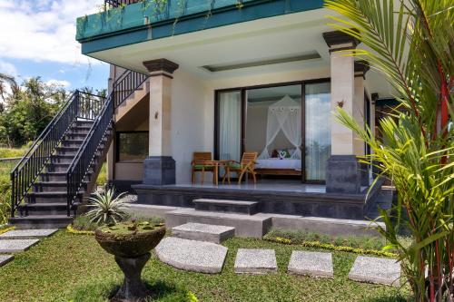 a villa with a view of the house at Cahaya Ubud Villa in Ubud