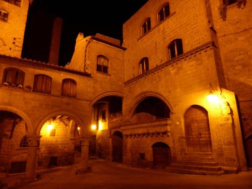an old building at night with lights at A Priori Guest House in Viterbo