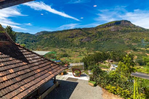 a view from the roof of a building with mountains in the background at Castillo De Woods , The Private Luxury Villa , 8 BHK, Vattavada in Kottakamboor
