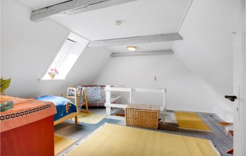 a attic room with white walls and a white ceiling at 2 Bedroom Cozy Home In Tønder in Tønder