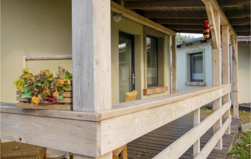 a porch of a house with a plant on it at 2 Bedroom Pet Friendly Home In Wilcze in Wilcze