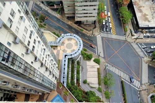 an aerial view of a building in a city at Muggle Stay Guest House - Bonifacio Global City Taguig in Manila