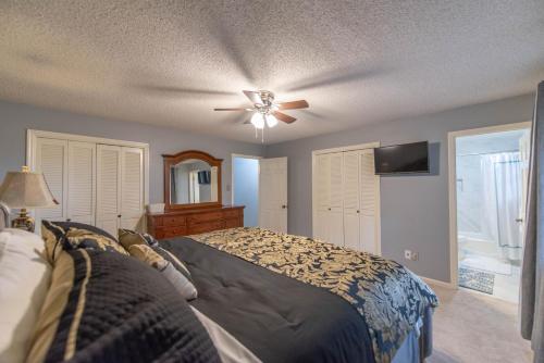 a bedroom with a bed and a ceiling fan at A Pleasant Home for Your Living Pleasure in Little Rock