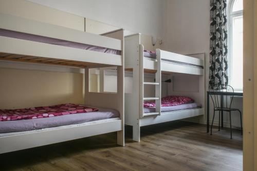 Ένα ή περισσότερα κρεβάτια σε δωμάτιο στο Hostel Diana Park