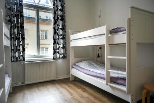Ένα ή περισσότερα κρεβάτια σε δωμάτιο στο Hostel Diana Park
