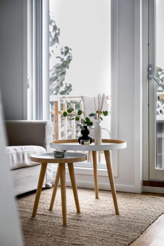a living room with a coffee table and a couch at New lakehouse - amazing sea view and private pier! in Stockholm