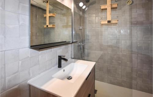 a bathroom with a white sink and a shower at Amazing Apartment In Rustrel With Outdoor Swimming Pool, Wifi And 2 Bedrooms in Rustrel