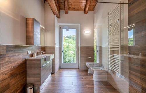 a bathroom with a sink and a toilet and a window at Stunning Home In Castino With Wifi And 4 Bedrooms in Castino