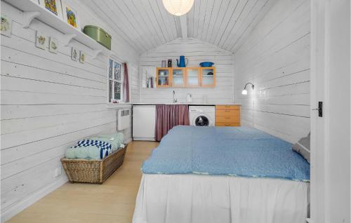 a bedroom with a bed in a white room at Gorgeous Home In Vordingborg With Wifi in Vordingborg