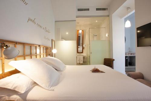 Ένα ή περισσότερα κρεβάτια σε δωμάτιο στο Hotel Madinat