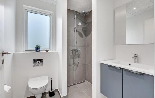 a bathroom with a shower and a toilet and a sink at Stunning Home In Lgstrup With Wifi in Løgstrup