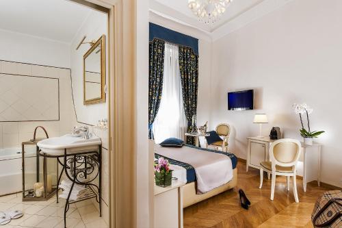 a hotel room with a bed and a bathroom at Dimora Degli Dei in Rome