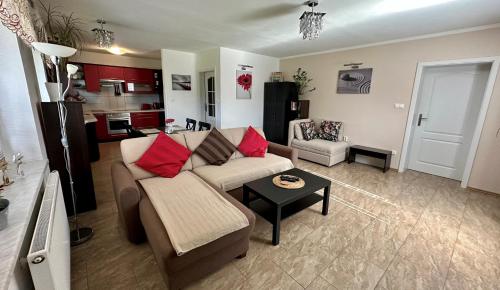 a living room with a couch and a table at Apartment Boroví in Karlštejn