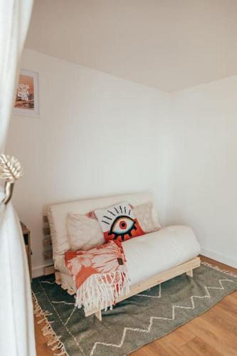 a white couch with pillows on it in a room at The Hideout - Newquay - Fully Stocked Eco Escape in Newquay