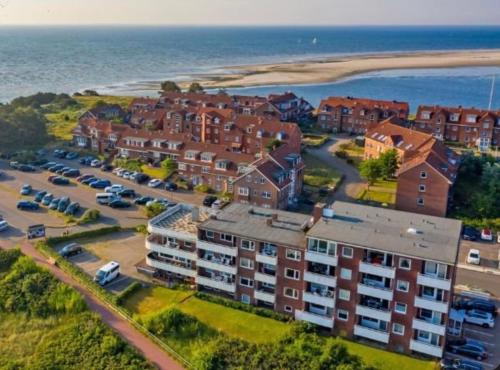an aerial view of an apartment complex next to the ocean at Haus Seelöwe Wohnung 1 in Wittdün