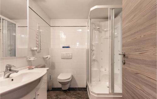 a bathroom with a shower and a toilet and a sink at App Heli in San Zeno di Montagna