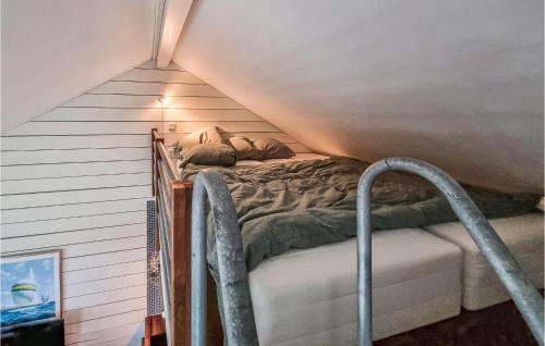 a bedroom with a bed in a attic at Stunning Apartment In Marstrand With Kitchen in Marstrand