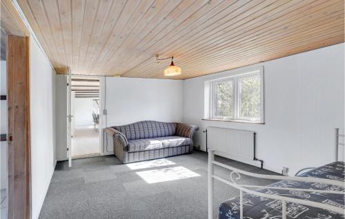 a living room with a couch and a window at Gorgeous Home In Højslev With Wifi in Højslev